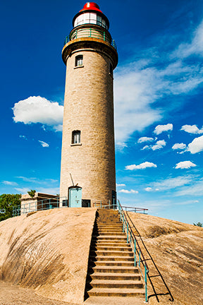#108: Lighthouse standing high in blue sky
